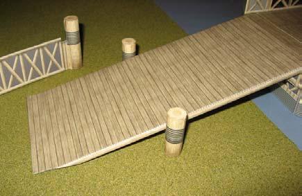 the assembly by sliding it up or down the Ramp until it supports the Ramp without lifting it off the ground
