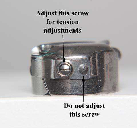 Check the tension of the bobbin by holding the loaded bobbin case in one hand. With one hand under the bobbin case, hold the tail of thread and watch as the thread flows out of the bobbin case.