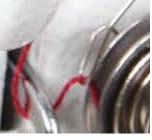 ) Figure 53 Step 6: While holding the thread up over the top of the tension hook