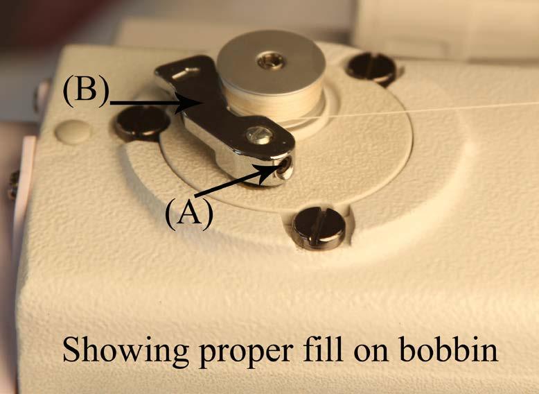 See figure 101 and 102 Note you do not need to pull the bobbin winder out to adjust this setting.