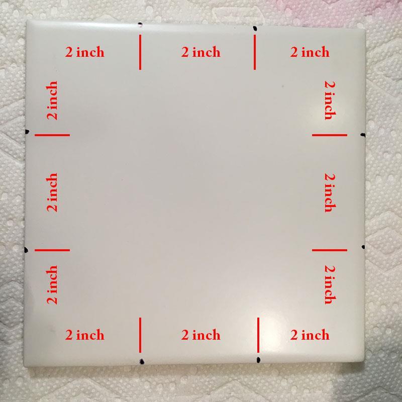 In this project, I will walk you through creating a tic tac toe game board using alcohol ink and a 6in x 6in tile. Start with a clean tile. You can use any size tile.