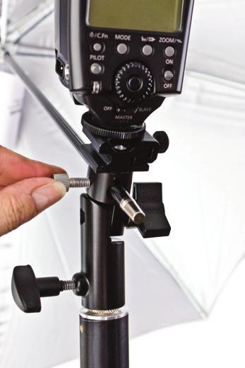 Gently wiggle the unit in all directions to ensure the flash is fully tightened and attached to the shoe mount umbrella