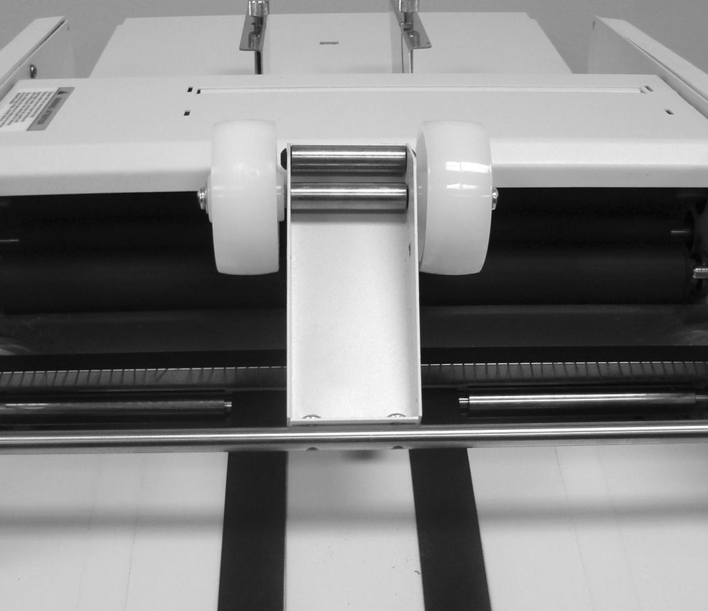 STACKER WHEEL SETUP FOR THICK PAPER Thicker paper from 28 # up to 65 # may require special stacker wheel setup moving the