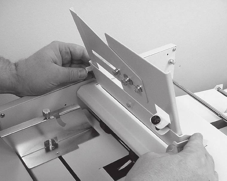 When feeding stapled sets the documents should be placed with the staple on the operators side and leading (Fig 9). 4.