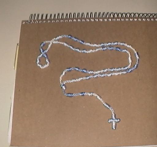 (Figure 13) Figure 13 Completed Rosary Please note that all excess string must be disposed of in the Ocean.