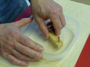 12 Using a hammer, pick the cutting template through the container which is placed