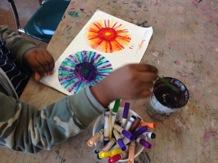To create the radial designs the students started with a round coffee filter and worked from the middle outwards to create patterns.