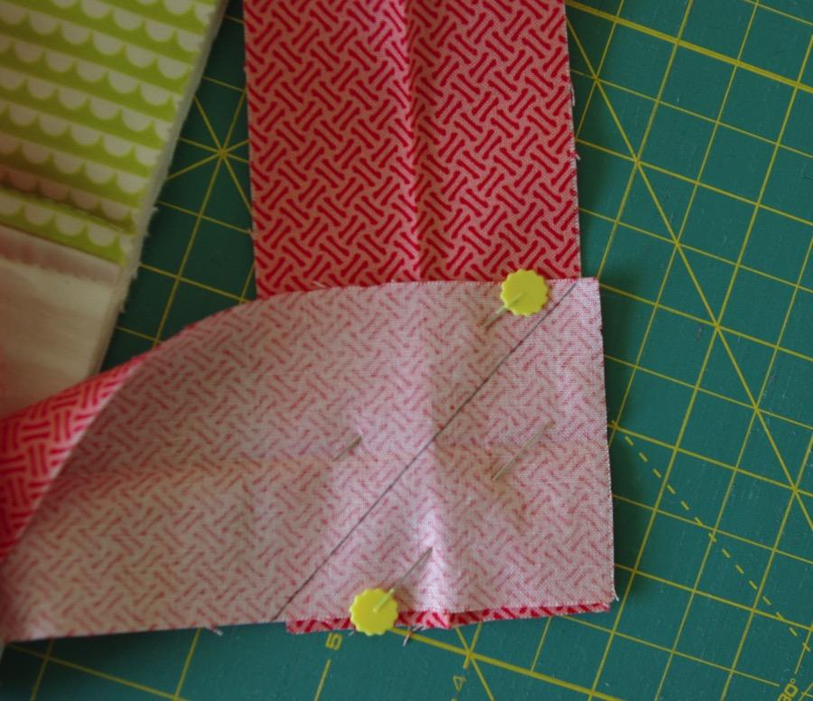 10 ATTACHING THE BINDING: Clip the binding to the quilt raw edge to raw edge, leaving an approximate 10" tail.