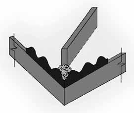 Apply mortar to the valley corrugation or use a plastic hip seal (for pitches 4:12 to 7:12).