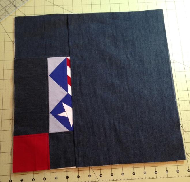 topstitched edge towards the center.