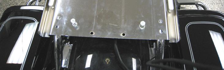 Remove the Tour-Pak from the support bracket. PIC 1 On CVO models, there will be a black Amplifier support plate on the support bracket. Leave this plate in place.
