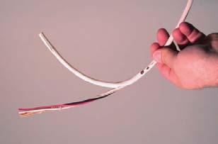 A cable ripper is used to split the outer jacket from the point where the wires will be exposed to the end of the cable. Place the cutting tooth in the center of the cable about 8 from the end.