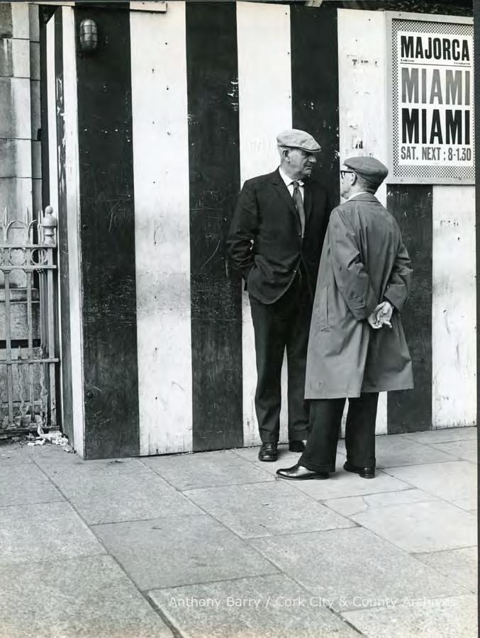 Reference: PH/AB/L/730 Date: 1960s-1970s Title: Photograph, street scene, Cork, 2 middle aged men in