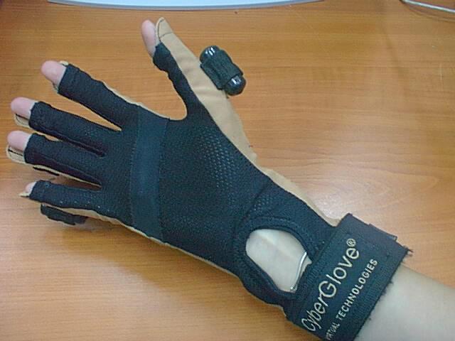 2. Consists of a sturdy Lycra glove with flat plastic strain gauge fibres coated with conductive ink running up each finger; measures change in resistance during bending to measure the degree of flex