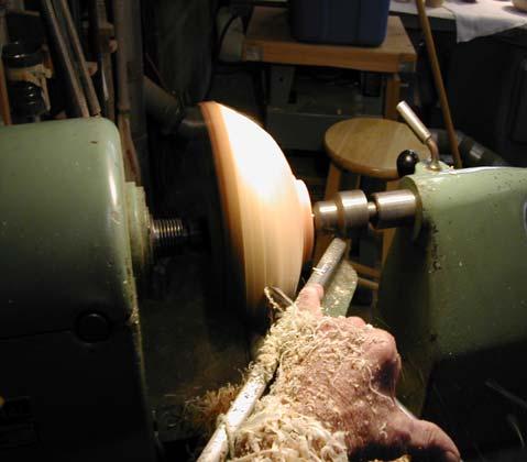Use a bowl gouge to finish shaping the outside of the bowl.
