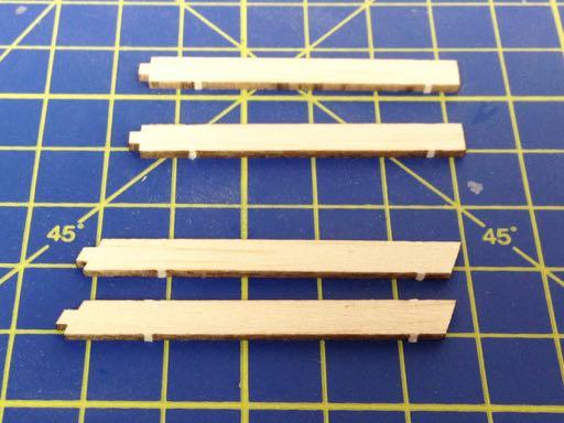 ADDING THE CABANE STRUTS TO THE FUSELAGE 1) As well as the fuselage and the cabane strut jig prepared in the previous steps, identify and remove all of the parts on the laser cut sheets: C1 and C2 (2