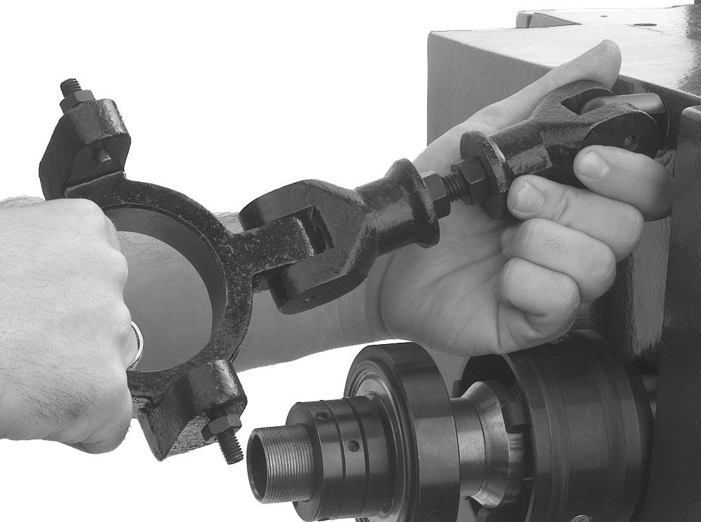 Position the locking yoke back inline with the setscrew holes on the draw tube assembly, then secure the setscrews and the jam nuts as shown in Figure 10. Connecting rod Locking yoke Figure 9.