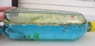 Once glue is dry, turn the bottle on the side. Rock it back & forth to make your own ocean wave.