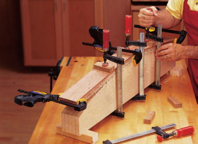 Work outward from the middle toward the ends, spacing your clamps at regular intervals, as shown in Photos F and G.