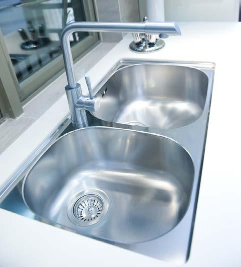 2 The photograph below shows a kitchen sink that has been manufactured from stainless steel.