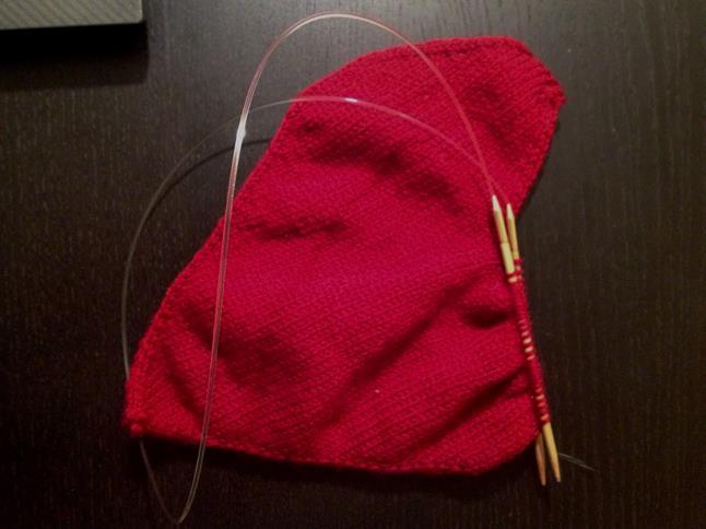 This will connect the two sides and close up the gap in the middle. There should be 27 stitches on each needle. Continue in the magic-loop and knit the backside stitches. K one more round.