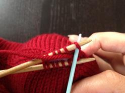 through, leaving the stitch on the needle.