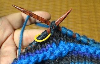 = Put the knitting tip into the last stitch as if to knit, slip the