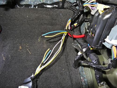 Cut the two wires half way up the wiring harness and strip the ends.