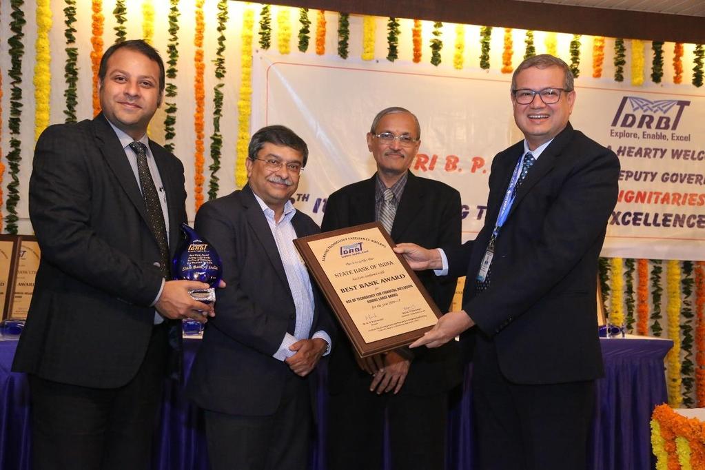 SBI receives Best Bank Award for Use of Technology for Financial Inclusion Among Large Banks. (L to R) Amit Saxena (Dy. CTO (e-channels), SBI), Sudarshan Sen (ED, RBI), S. Ganesh Kumar (ED, RBI), D.