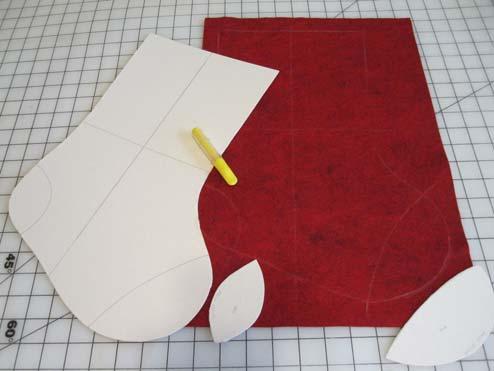Cut out the pattern pieces. Add heel and toe fabric and embellishments as desired (see instructions below). Cut out the front of the stocking only.