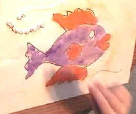 Using a paintbrush or fingers, have the children spread glue in the fins and mouth of the Salty template. o It doesn't have to be perfect! o We used orange for this step.