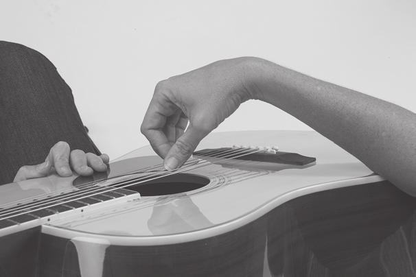 For Playing Fingerstyle The fingers should be curved and resting on the strings slightly to the left side of the tip of the finger.