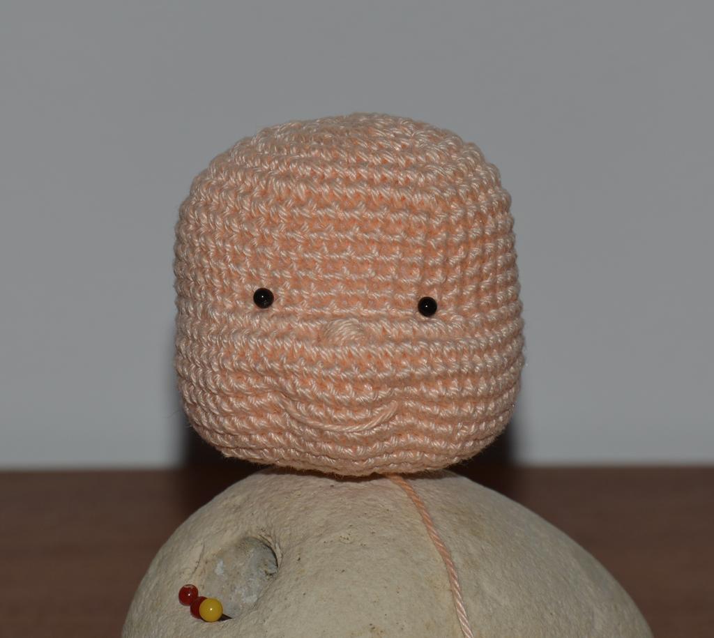 Your little face is finished. You can sew the eyes on.