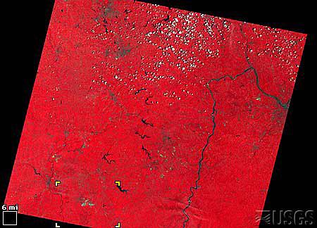 coal mining in eastern Ohio. In these images vegetation is red, water is black to dark blue, and the mines are bright gray.