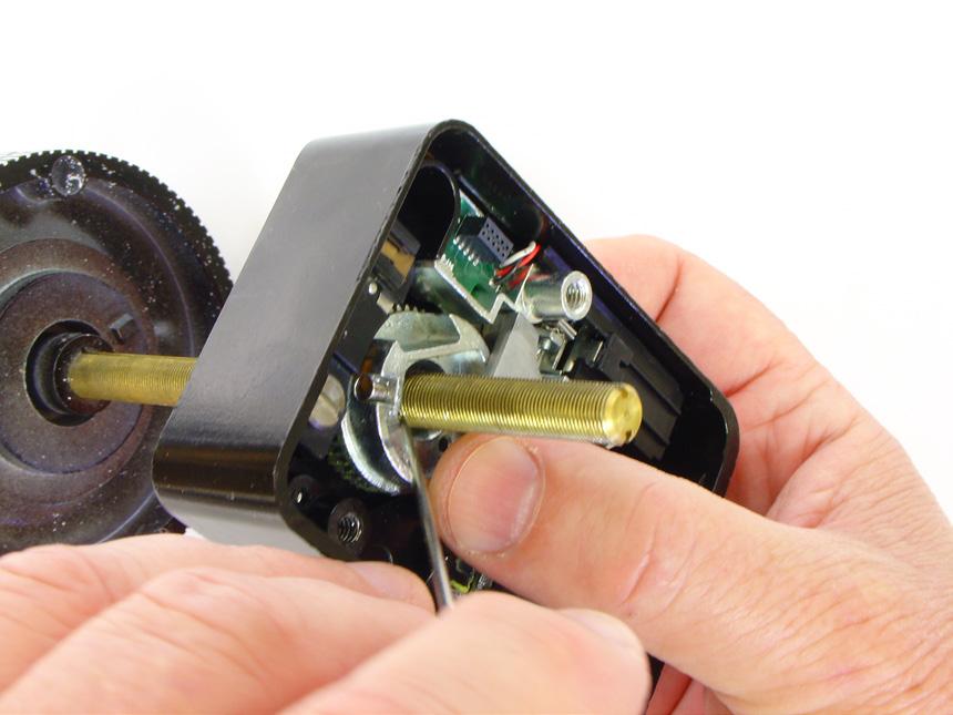 Hold the drive cam in place in the lock case and thread the dial/spindle assembly into the cam until the dial s edge is nearly flush with the top of the dial ring (Figure 4, far right) or until the