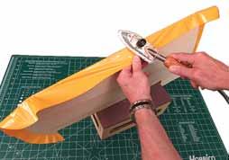 6. Pull and wrap the covering around the leading edge of the wing for a suitable overlap between the top and bottom pieces about a 1/8 [3mm] overlap is usually desirable for
