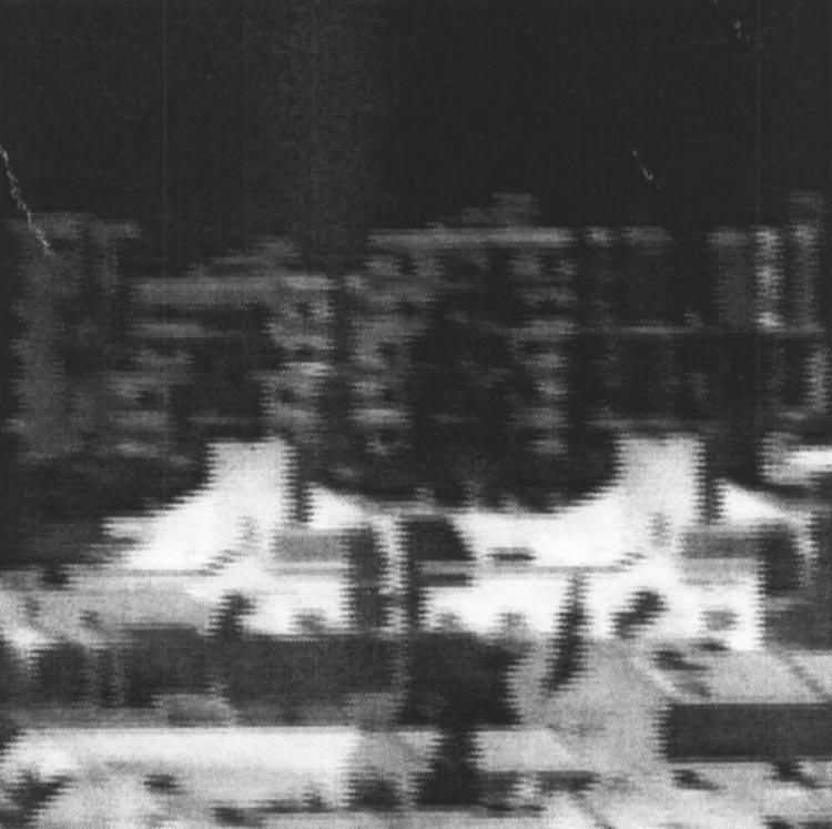 Fig. 11 An original degraded interlaced image acquired by a thermal camera during a manual movement of the camera. Fig. 13 The restored (deblurred and realigned) image.