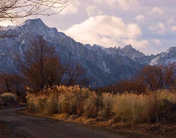 Still working within Photoshop, I selected an evocative landscape scene of sunlit wintry foliage along a lonely country road, with the snow capped Eastern Sierras in the background.