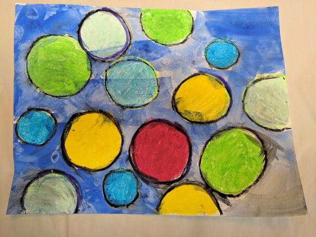 Optional: outline the circles in black oil pastel. 11. Have students sign their names in bottom right corner.