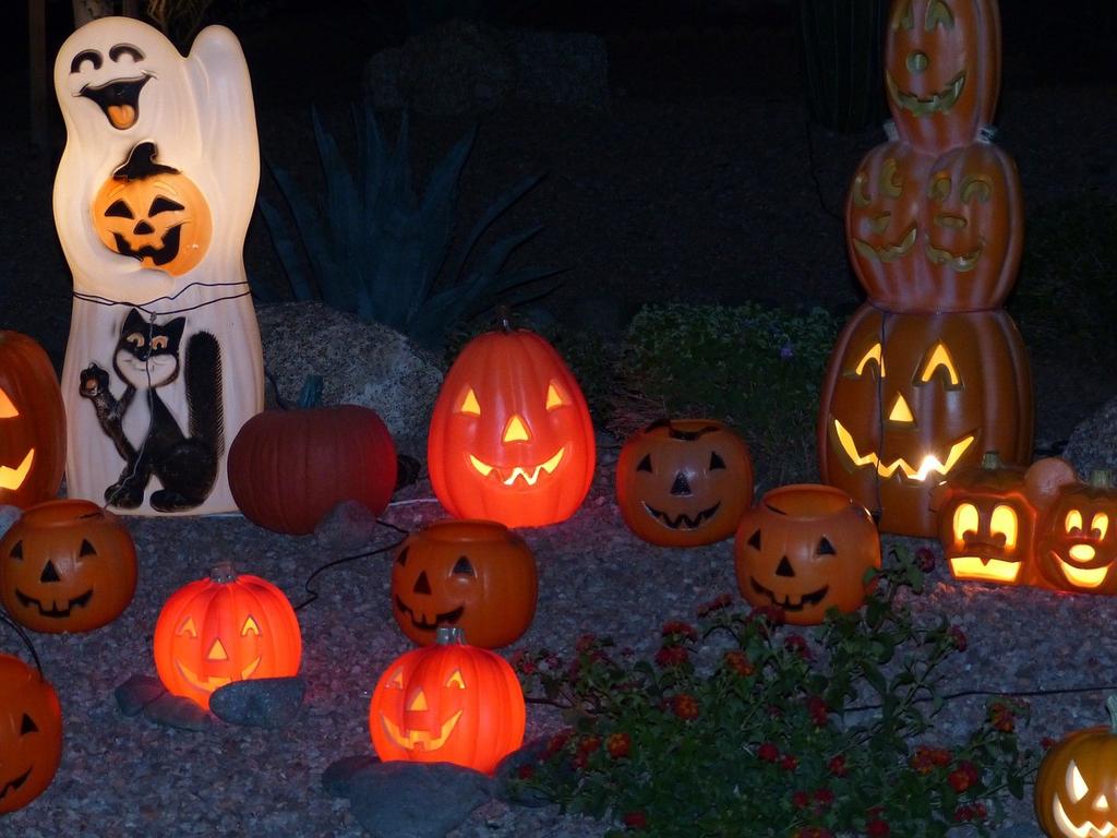 While I am trick-or-treating, I will see lots of Halloween decorations like ghosts and jack-o-lanterns.