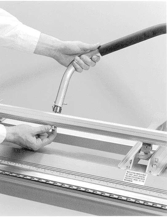 Remove the combination Lifting/Bending Handles from each end of the Port - O - Bender by removing the Faspins as shown.
