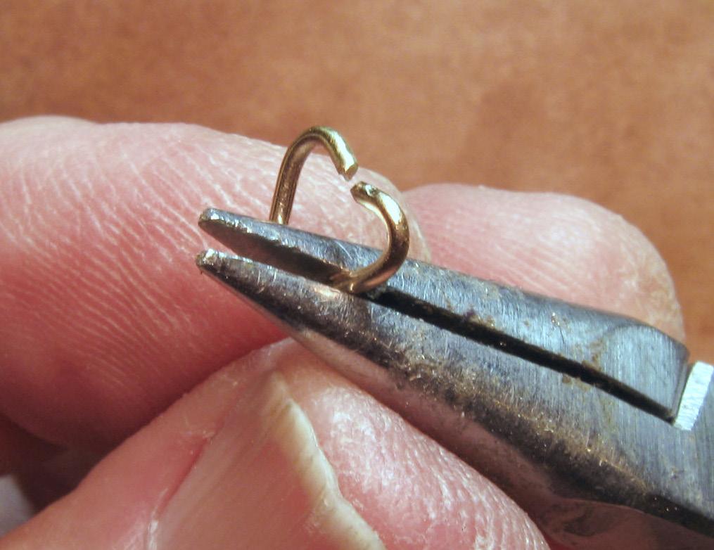 The disk should fit inside the ring with a small edge protruding above the rim of the ring [4]. Shape the wire embellishment. Cut a 3 4-in. (19 mm) piece of 20-gauge (0.