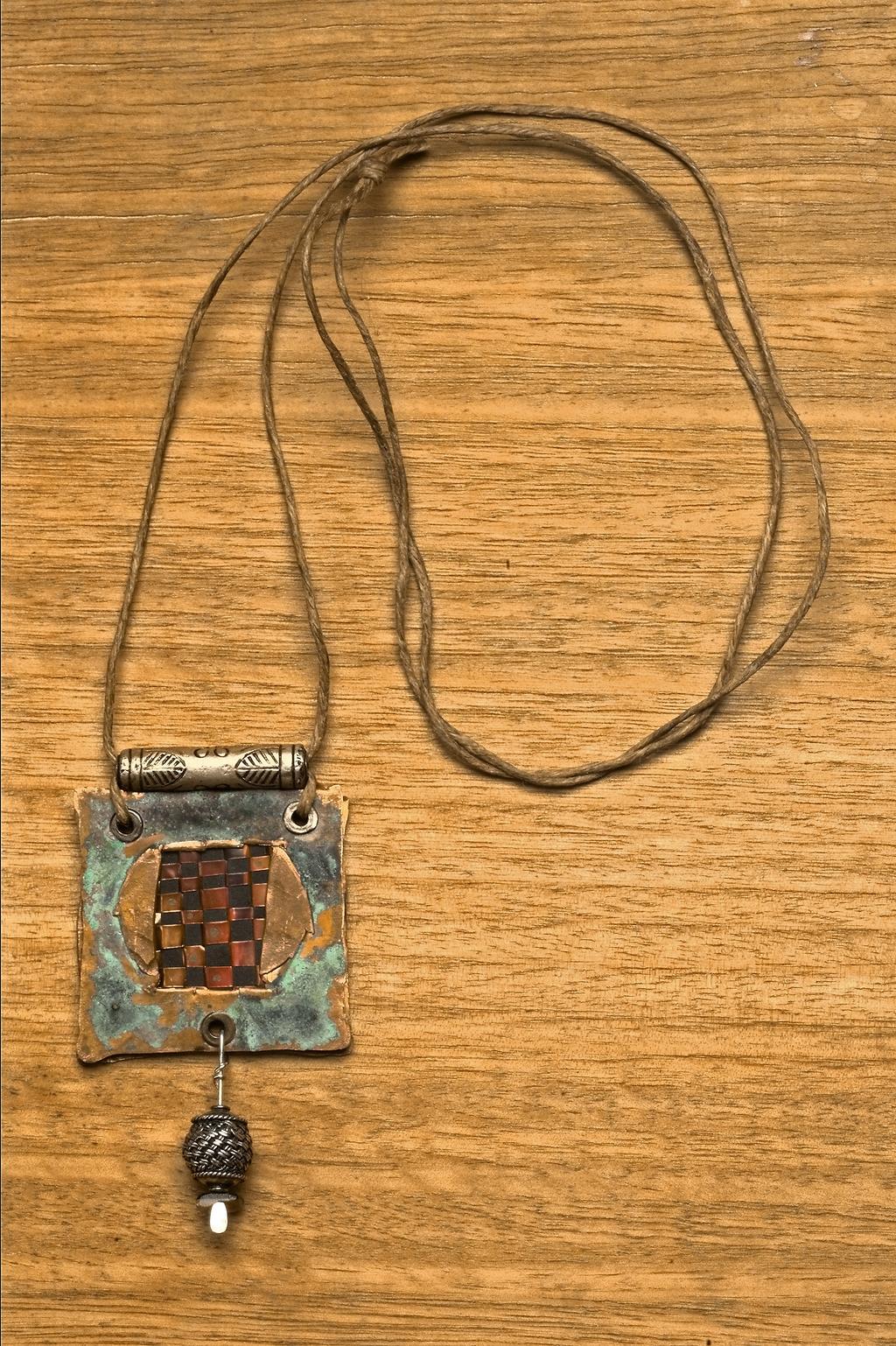 beginner metal Woven in Copper Copper windows showcase beautifully woven bands in a simple but stylish pendant by Mary Hettmansperger C opper is one of the most colorful and economical metals on the