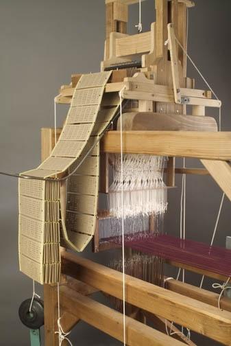 The industrial revolution saw the invention of the power loom (before everything had been woven by hand).