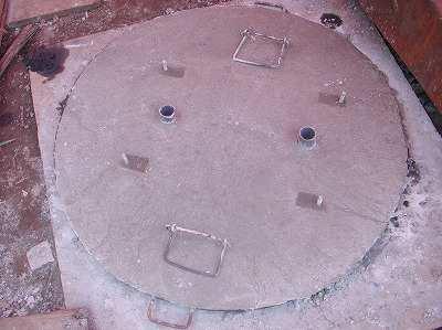 the well cover is convex to allow water to flow off.
