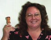 Becky Frisbee presented her first bottle stopper, of plum, finished with