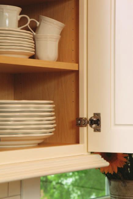 SHOWN: Door Style: Revival Color: White Dove Standard natural maple melamine interior is easy to clean.