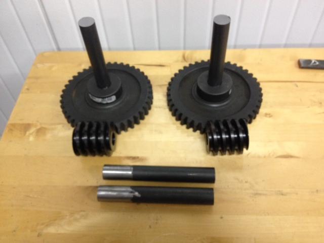 Worm Gears and Shafts The worm gears were purchased and have arrived. A 1 diameter bar was cut in 7 inch segments then grinded down for a more appropriate fit in the mounted bearings and gears.
