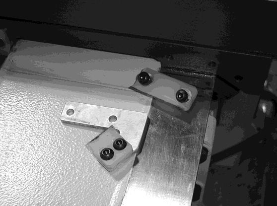 If adjustment is required loosen the clamp screw and rotate the shaft with an allen key until there is a snug fit between the bed and the copy saddle.