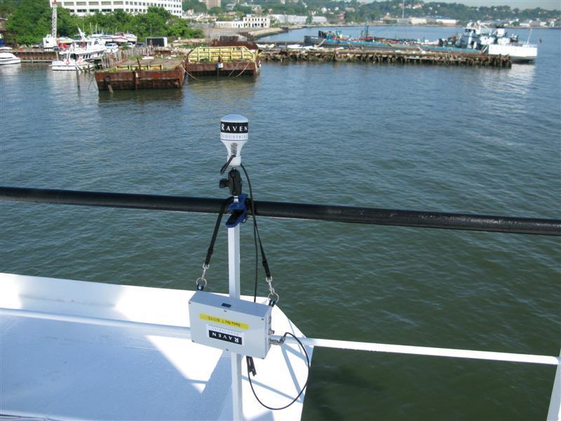 3. Using a clamp mount or a magnetic mount, position the antenna on the bridge wing where it has an unobstructed view of the sky. Figure 12: Correct Antenna Mounting Using Clamp 4.